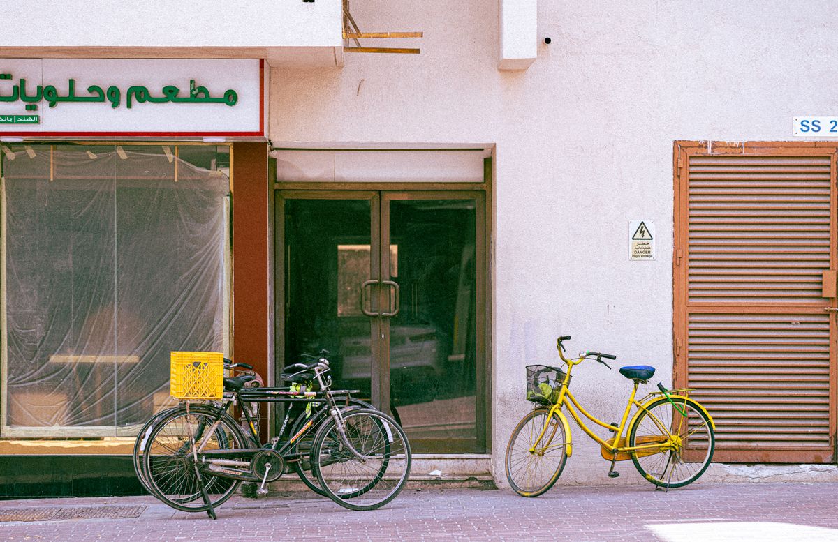Bikes parked outside a traditional Arabic shop in Dubai neighbourhood