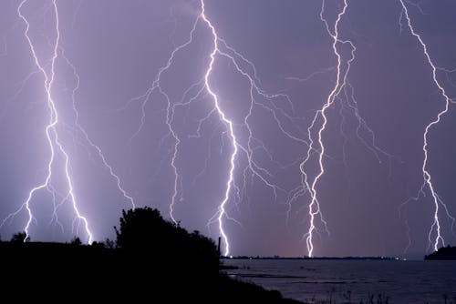 Dramatic Sky with Lightnings over Sea