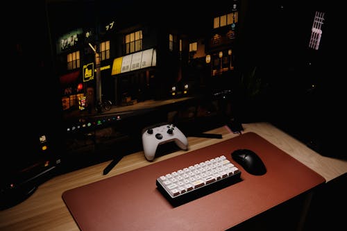 Keyboard, Mouse and Controller near Monitor
