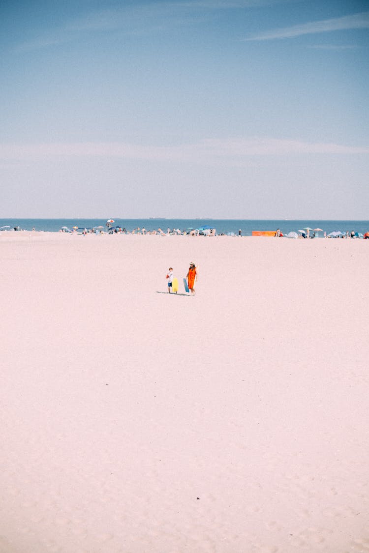 Mother With Child On Beach