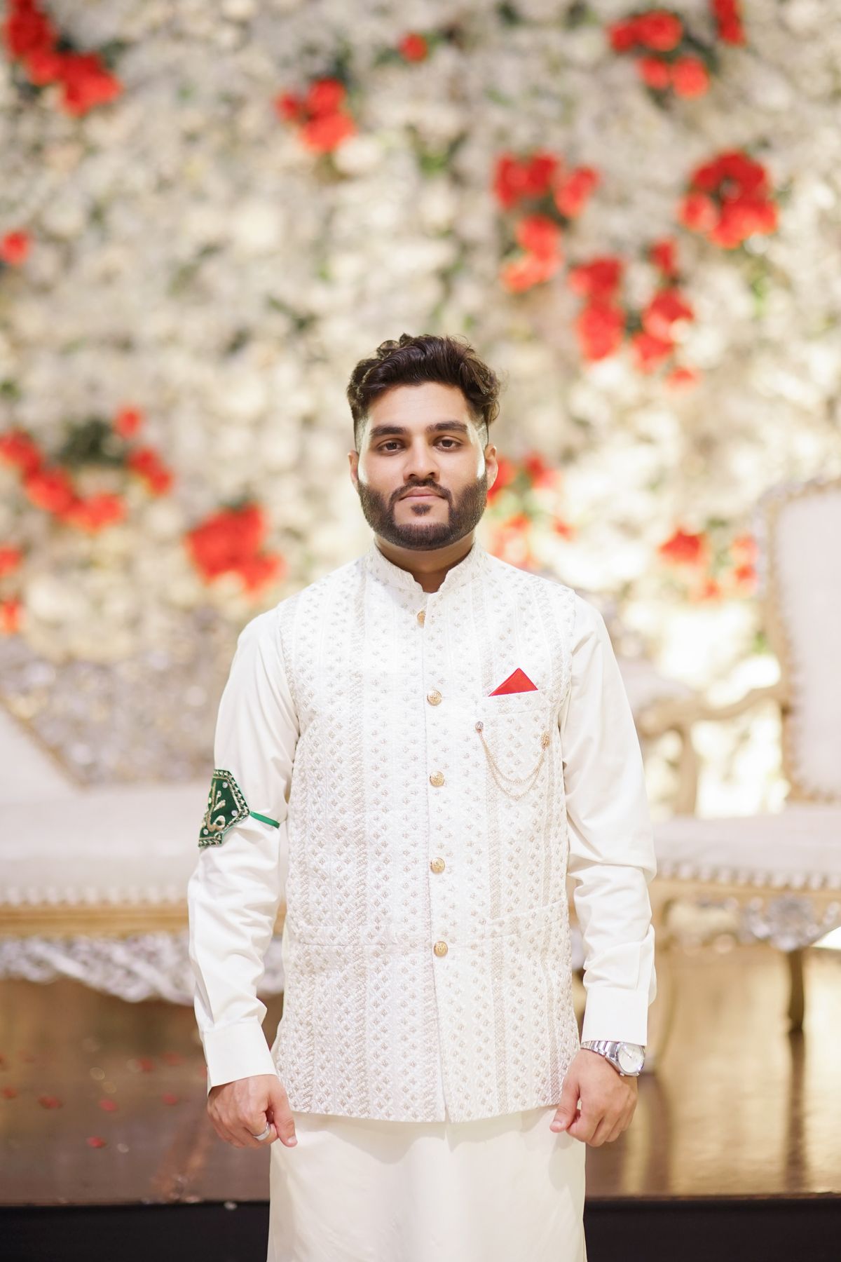 Pakistani groom in traditional white wedding attire in Islamabad