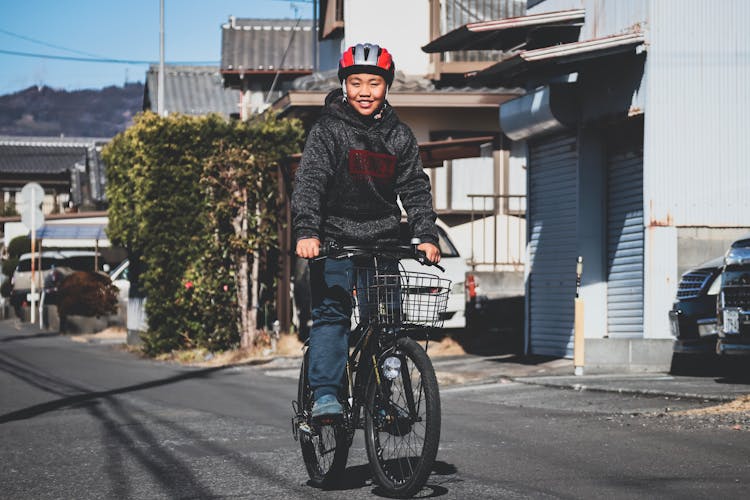 Photo Of Woman Riding On Bicycle On Street