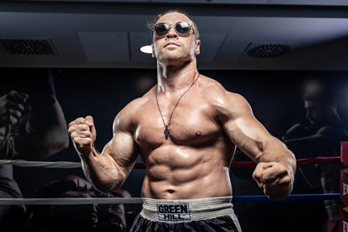 Portrait of Topless Bodybuilder in Sunglasses