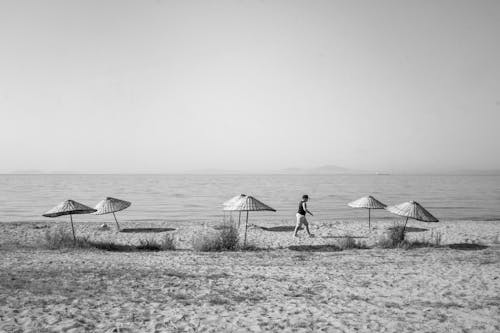 A Person Walking on the Beach