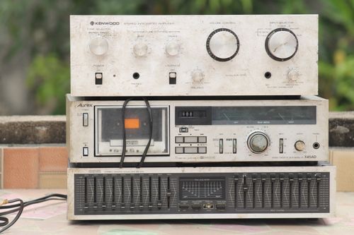 Free Retro stereo setup with vintage Kenwood amplifier and graphic equalizer on display. Stock Photo