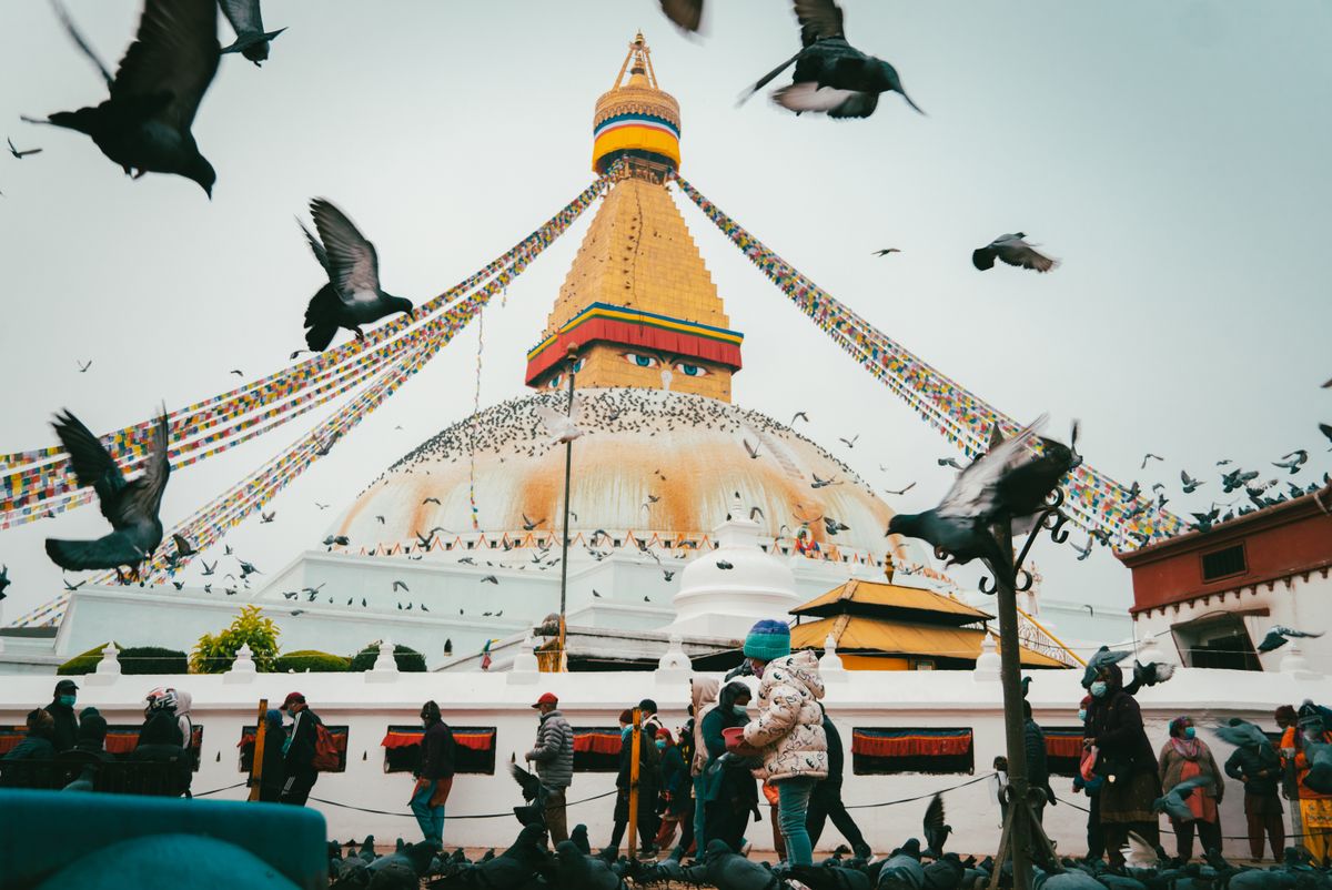 Boudhanath Stupa in Kathmandu draped in marigold garlands during Buddha Jayanti