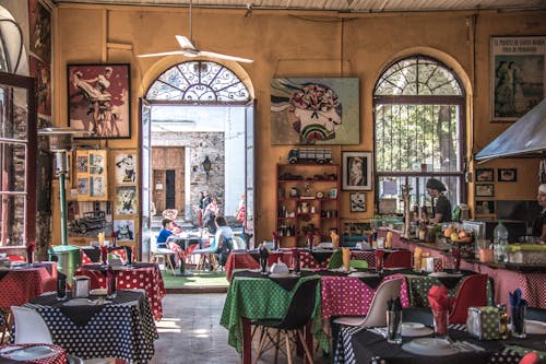 Restaurant Hall and Customers at Tables Outside