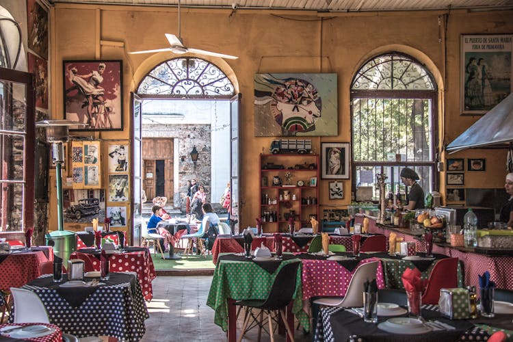 Restaurant Hall And Customers At Tables Outside