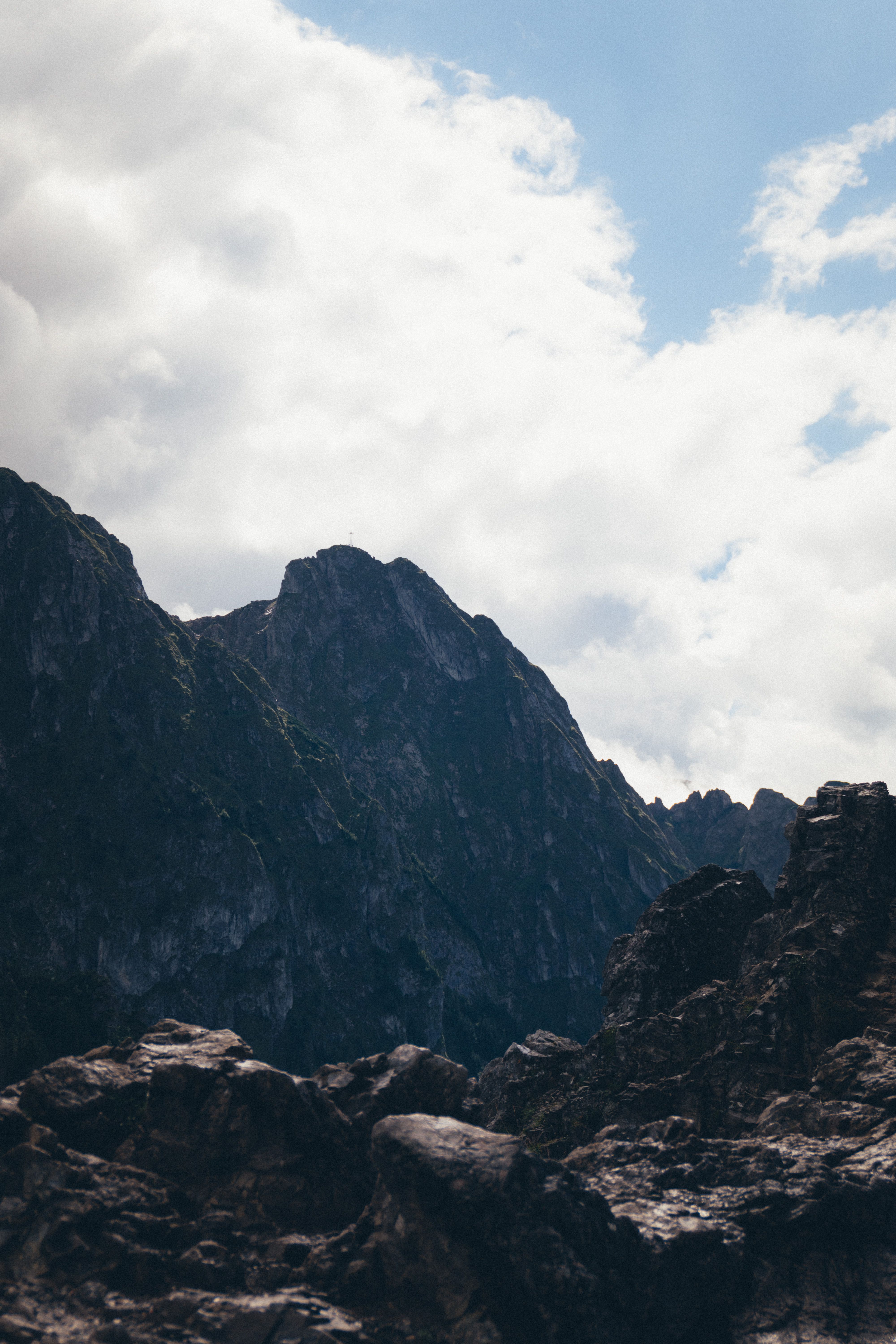 Breathtaking view of the Tatra Mountains with rocky peaks and dramatic sky.