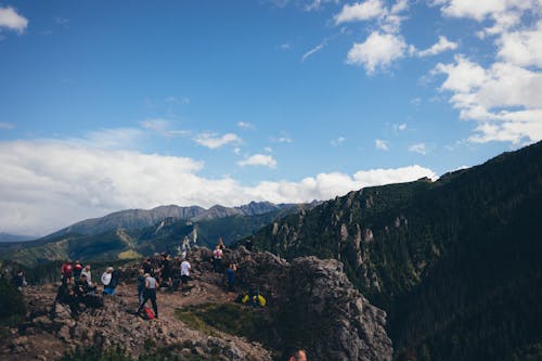 Hikers Standing on Mountain Peak