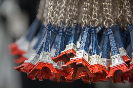 Close-up of Eiffel Tower souvenir keychains in Paris, France, emphasizing abundance and vibrant colors.