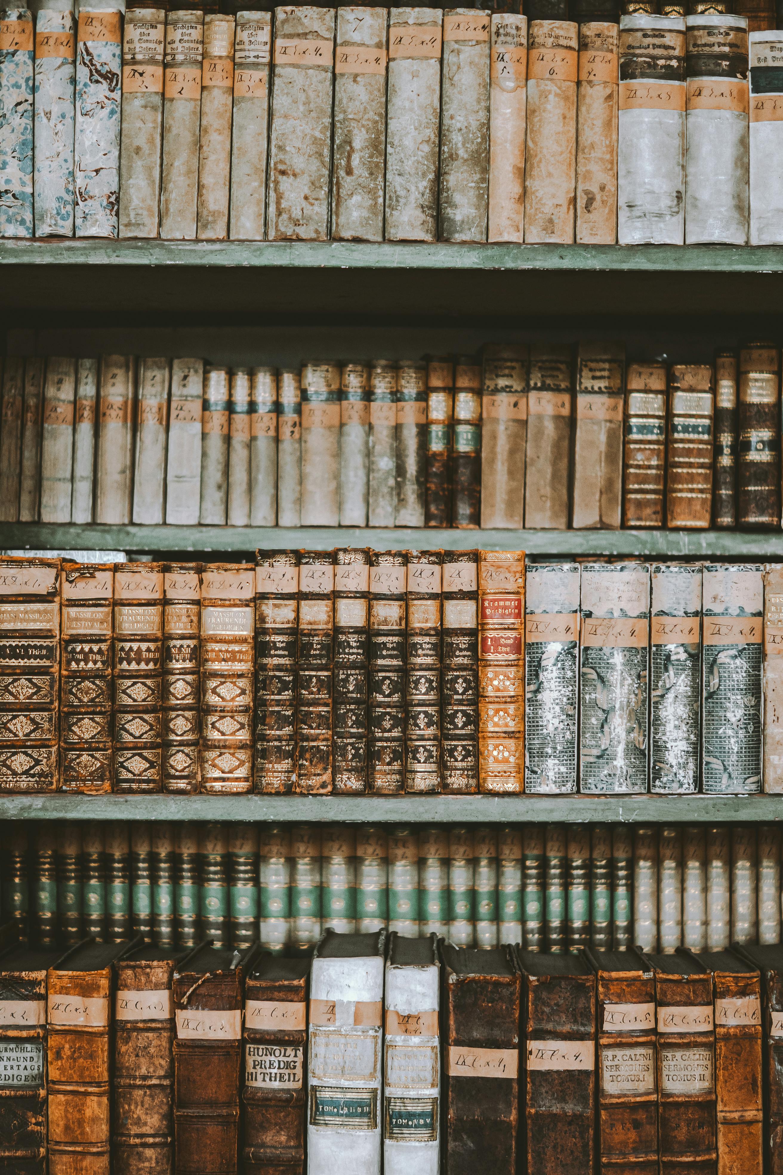 a row of old books on a shelf