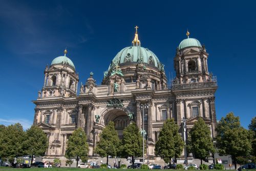 Free The iconic Berlin Cathedral stands majestically against a clear blue sky, ideal for travel photography. Stock Photo