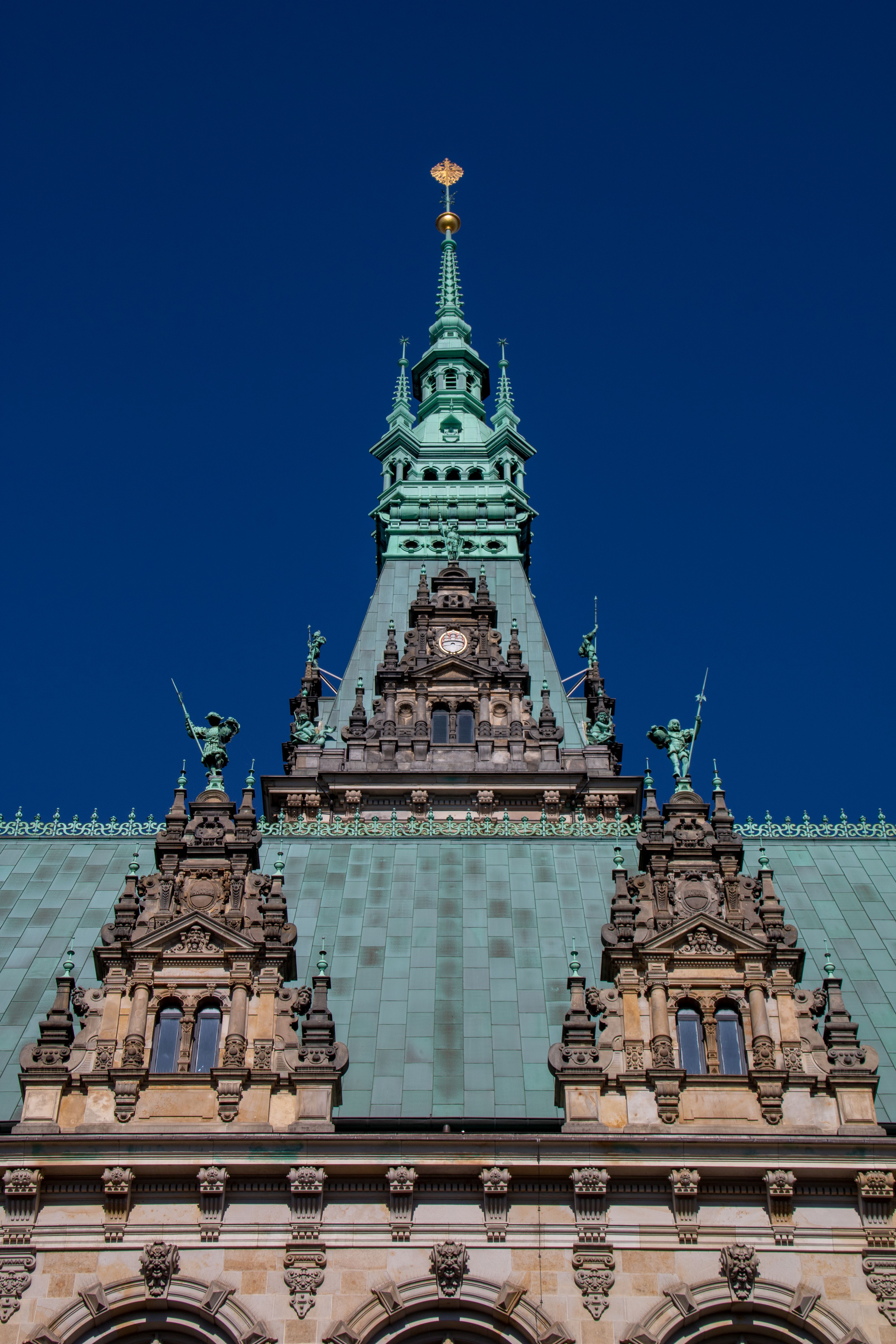 Free Close-up view of the Hamburg City Hall facade showcasing intricate architectural details under a clear blue sky. Stock Photo