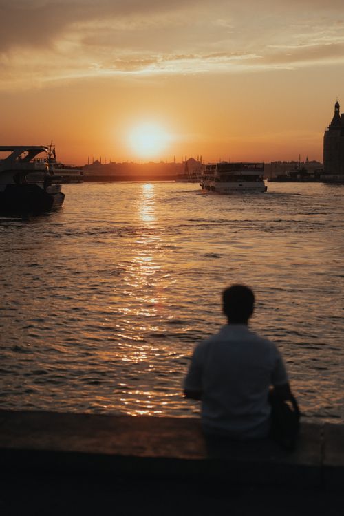 Free Beautiful sunset over the Bosporus in Istanbul with a person admiring the view. Stock Photo