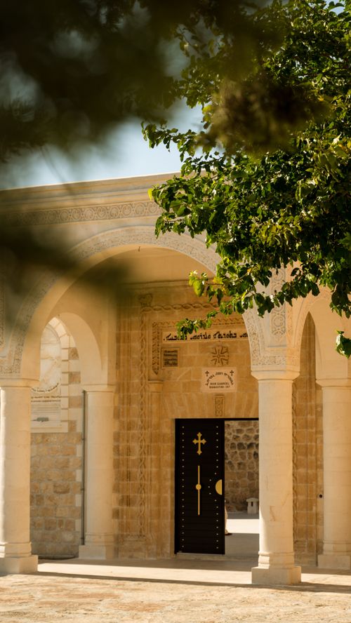 Free Beautiful doorway and arches of an Islamic building with a tree in the foreground. Stock Photo
