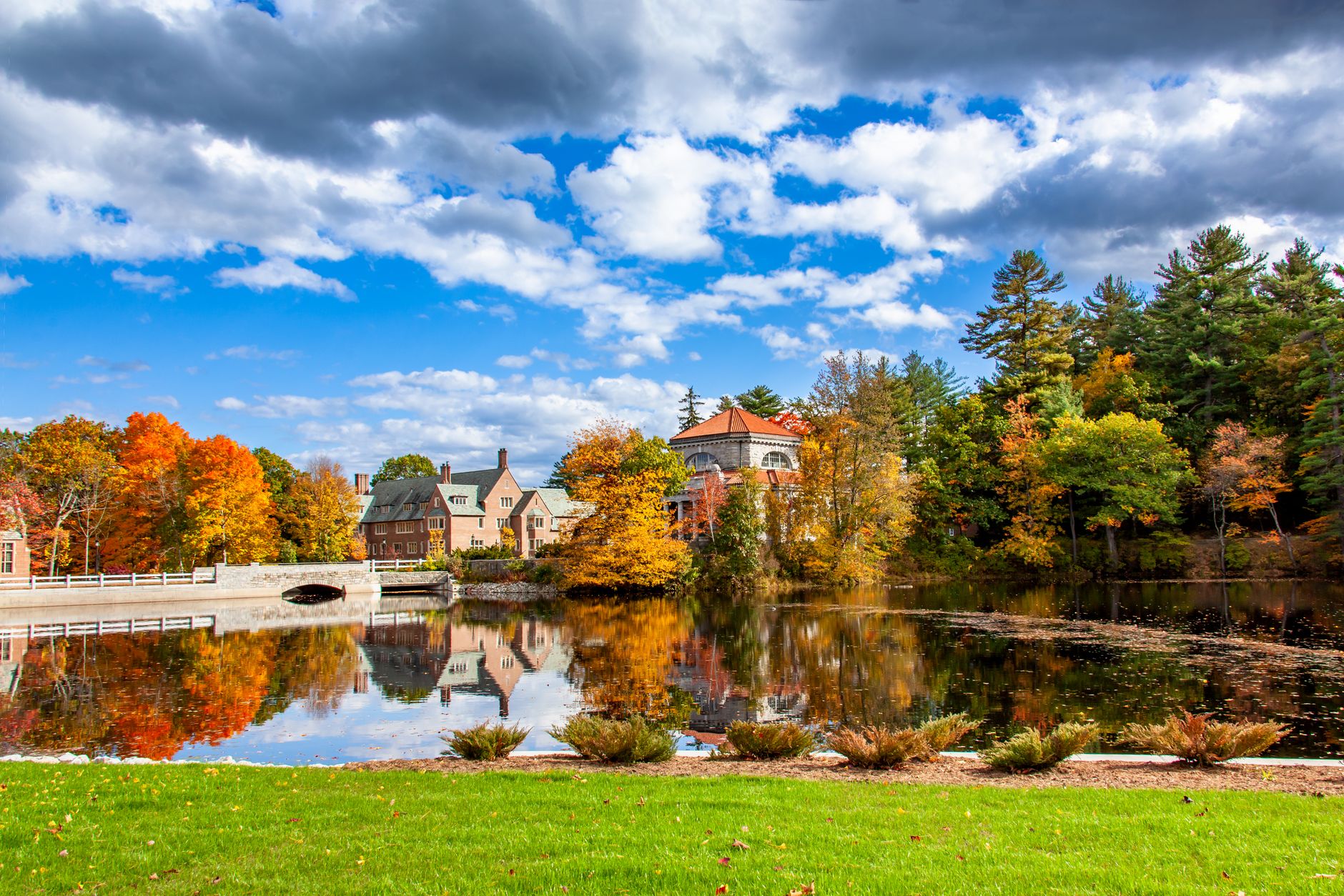 Picturesque autumn landscape featuring vibrant foliage and calm waters in Concord, NH.