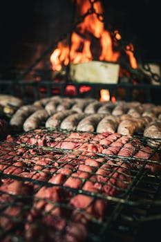 Delicious assortment of meats grilling over open flames, capturing a classic Uruguayan barbecue scene.