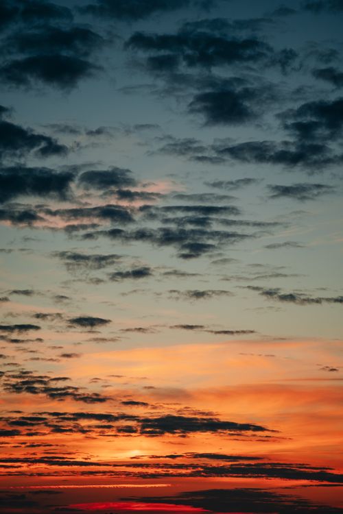 Free Stunning sunrise with dramatic clouds and vibrant colors over Minsk, Belarus. Stock Photo