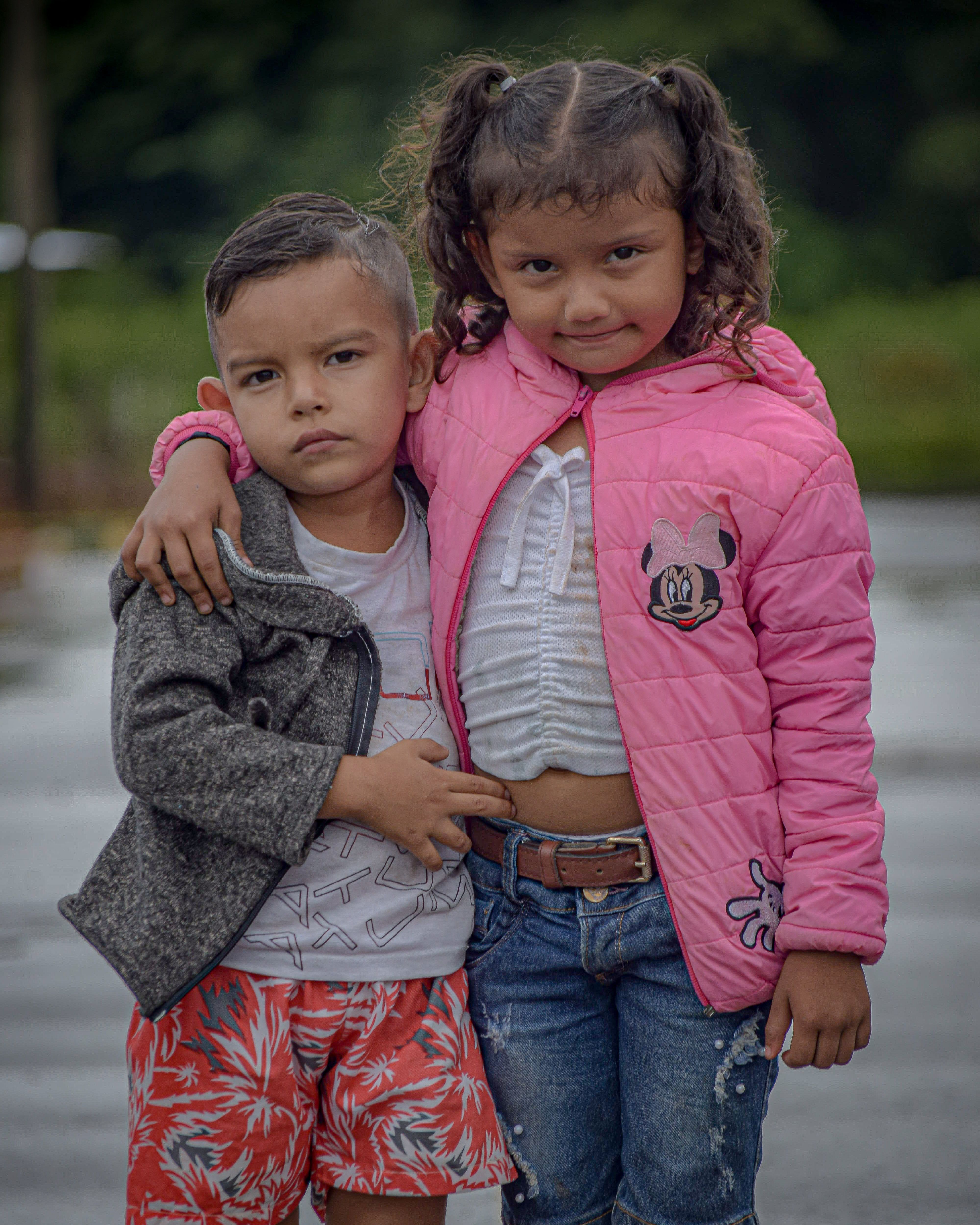 A Boy and Girls Standing Together · Free Stock Photo