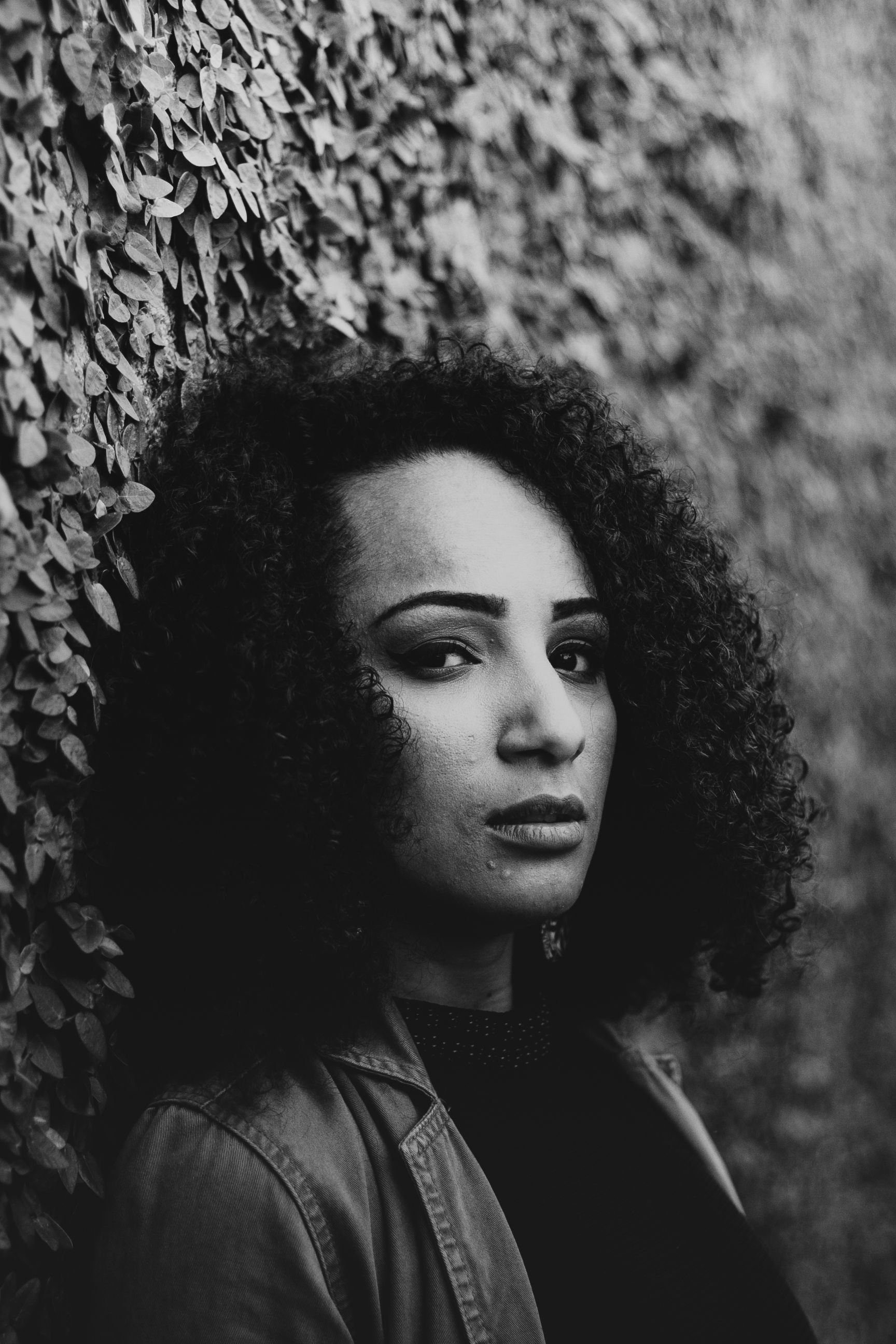 woman-with-curly-hair-in-black-and-white-free-stock-photo