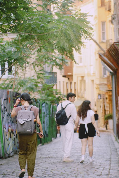 Free Couple walking through Istanbul's cobblestone streets, capturing urban charm. Stock Photo