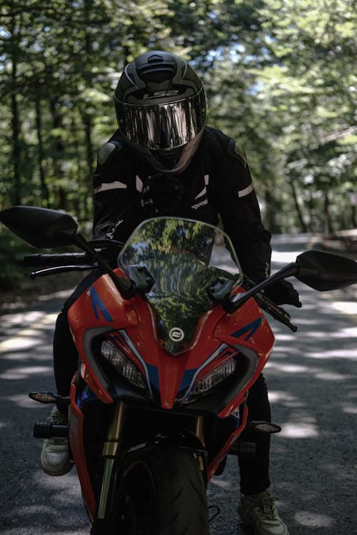 A person wearing a helmet on a motorcycle