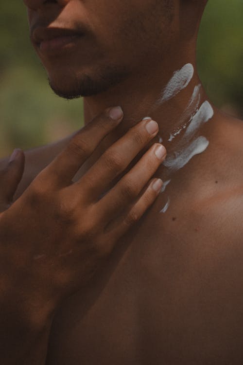 Man Putting Paint on Neck