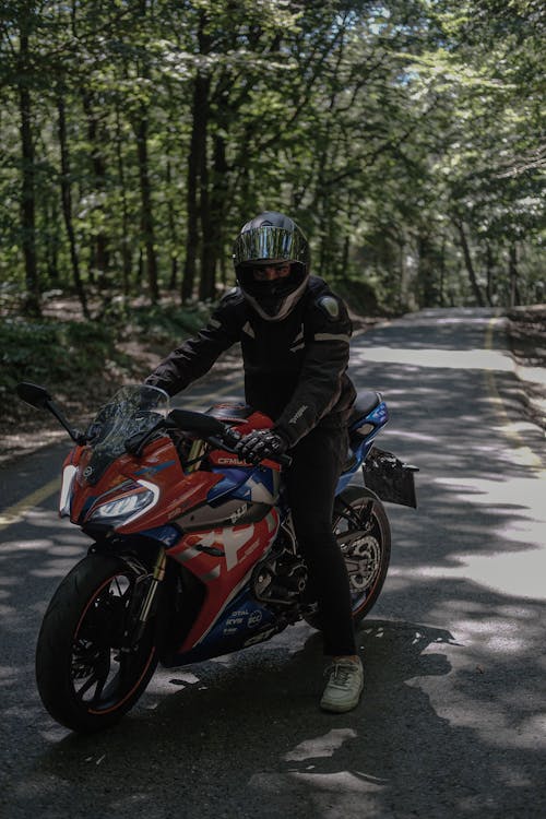 A person riding a motorcycle on a road