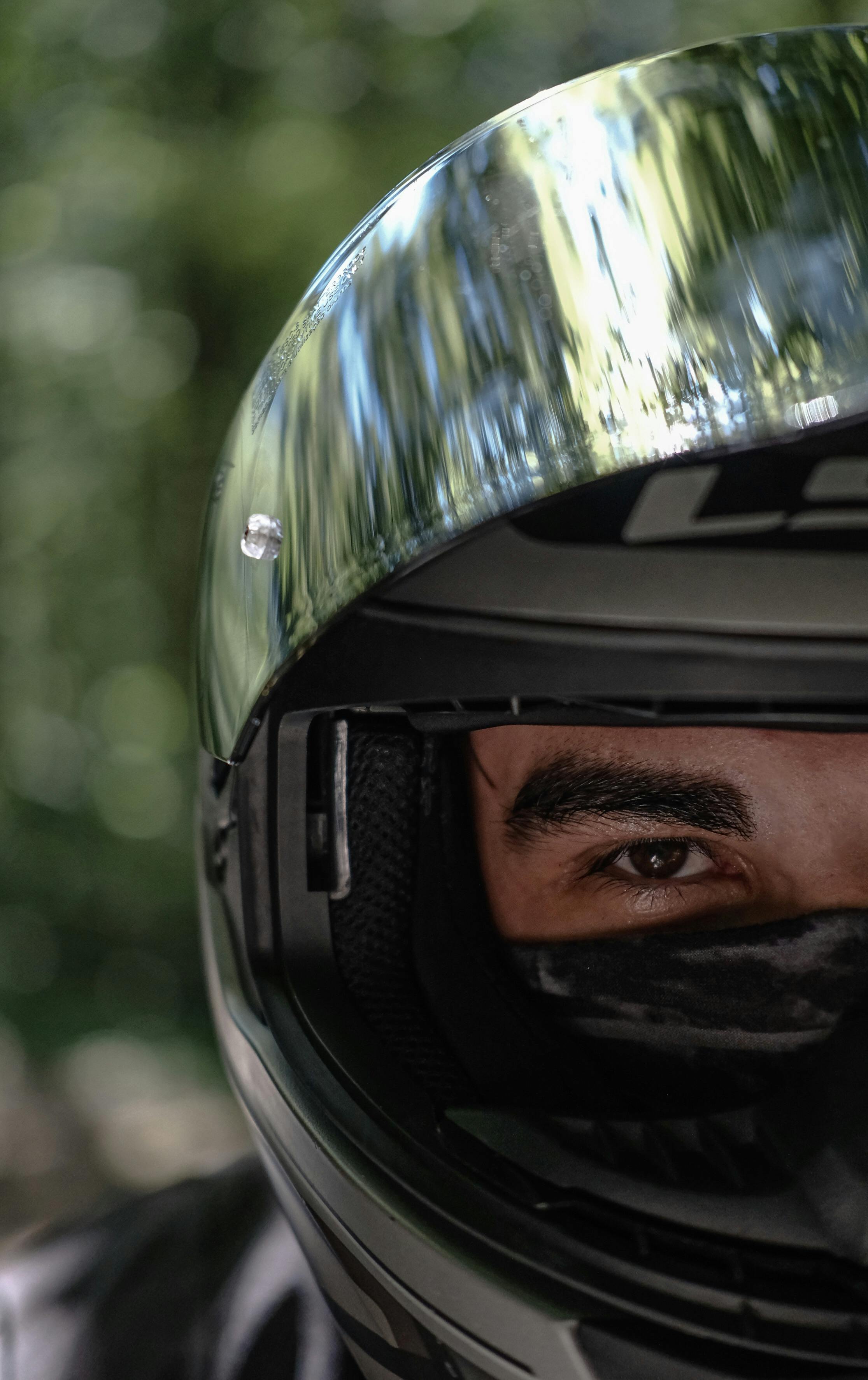 a man wearing a helmet and sunglasses