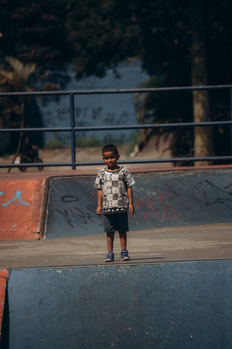 Boy Standing In Skatepark