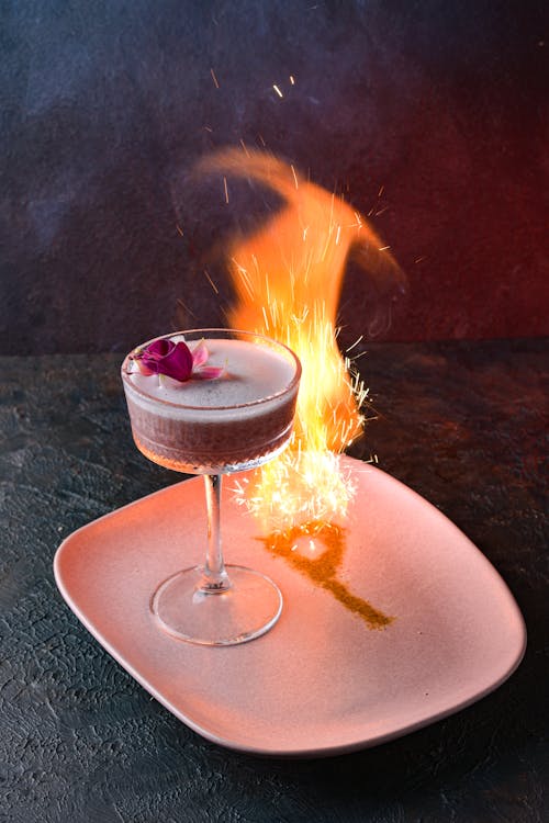 Free Fire Sign Burnt on Plate with Cocktail Stock Photo