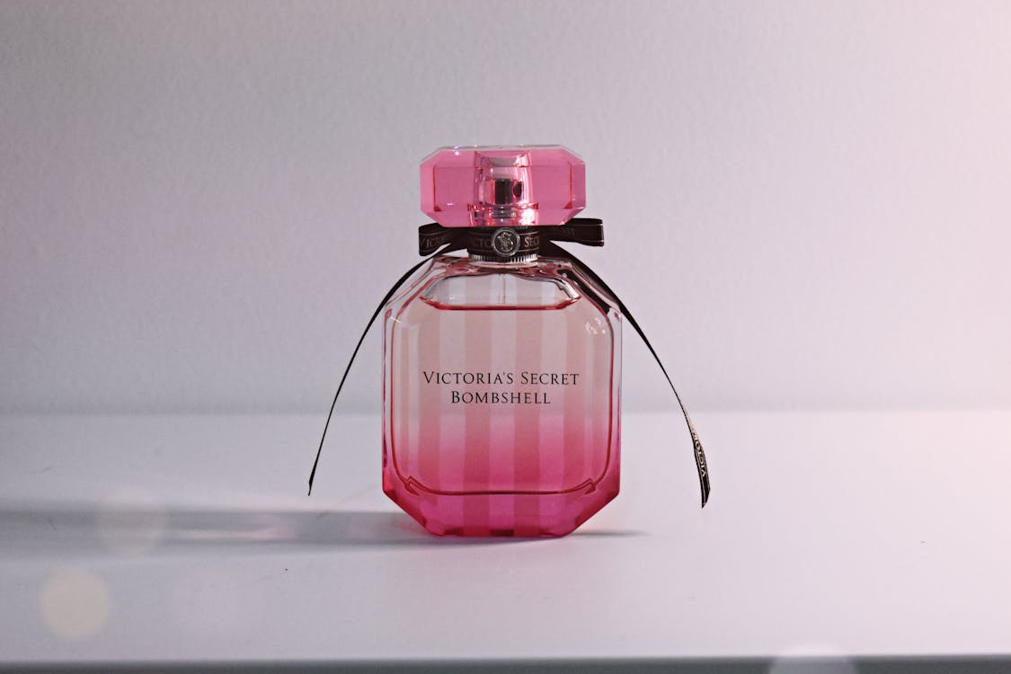 Free Victoria's Secret Bombshell Fragrance Bottle On White Surface Stock Photo