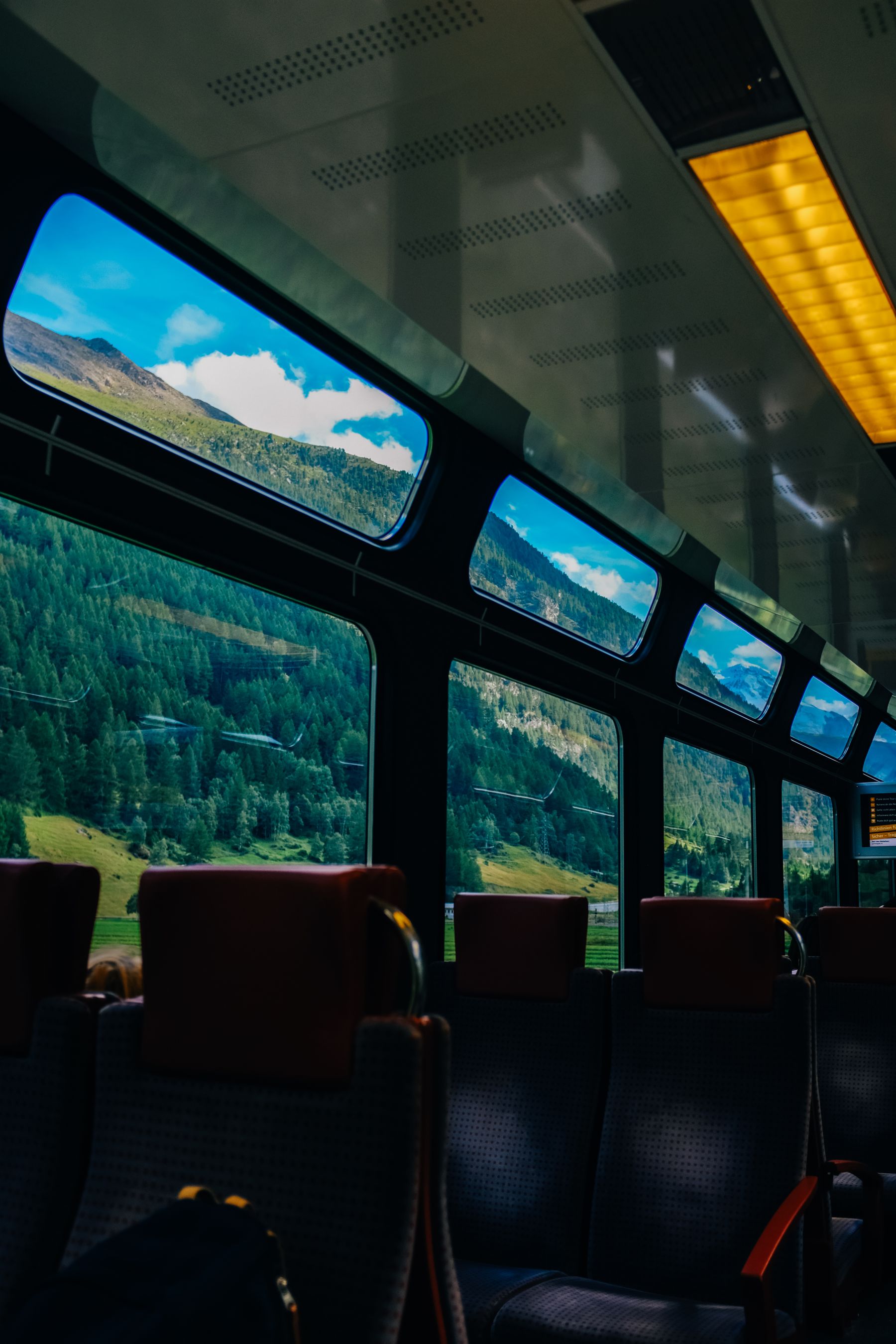 Scenic rail journey viewed from a passenger carriage