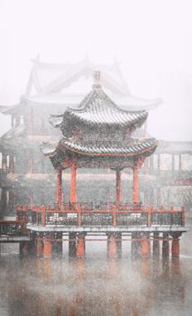 Beautiful Chinese architecture with a pagoda in rain, reflecting tranquil culture and tradition.