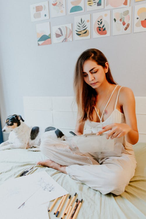 A Woman Sitting on a Bed