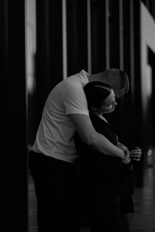 Free A couple embraces affectionately in a black and white photo in Ternopil, Ukraine. Stock Photo