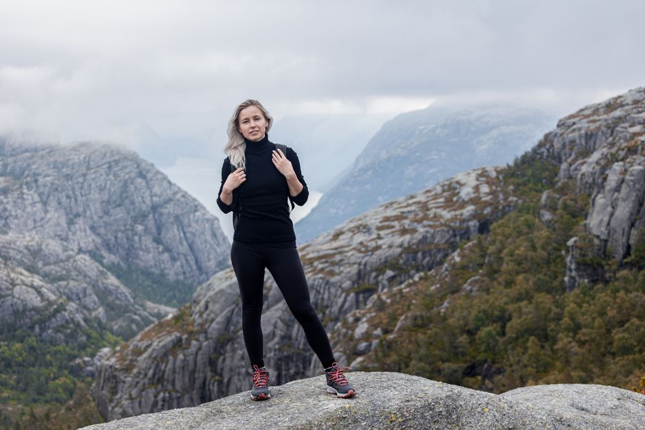 Hiker wearing layers and waterproof gear in the Norwegian mountains
