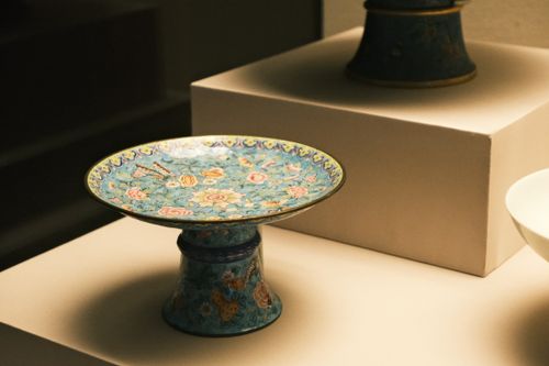 Free Beautiful ornate porcelain plate with intricate floral design on display in a museum. Stock Photo