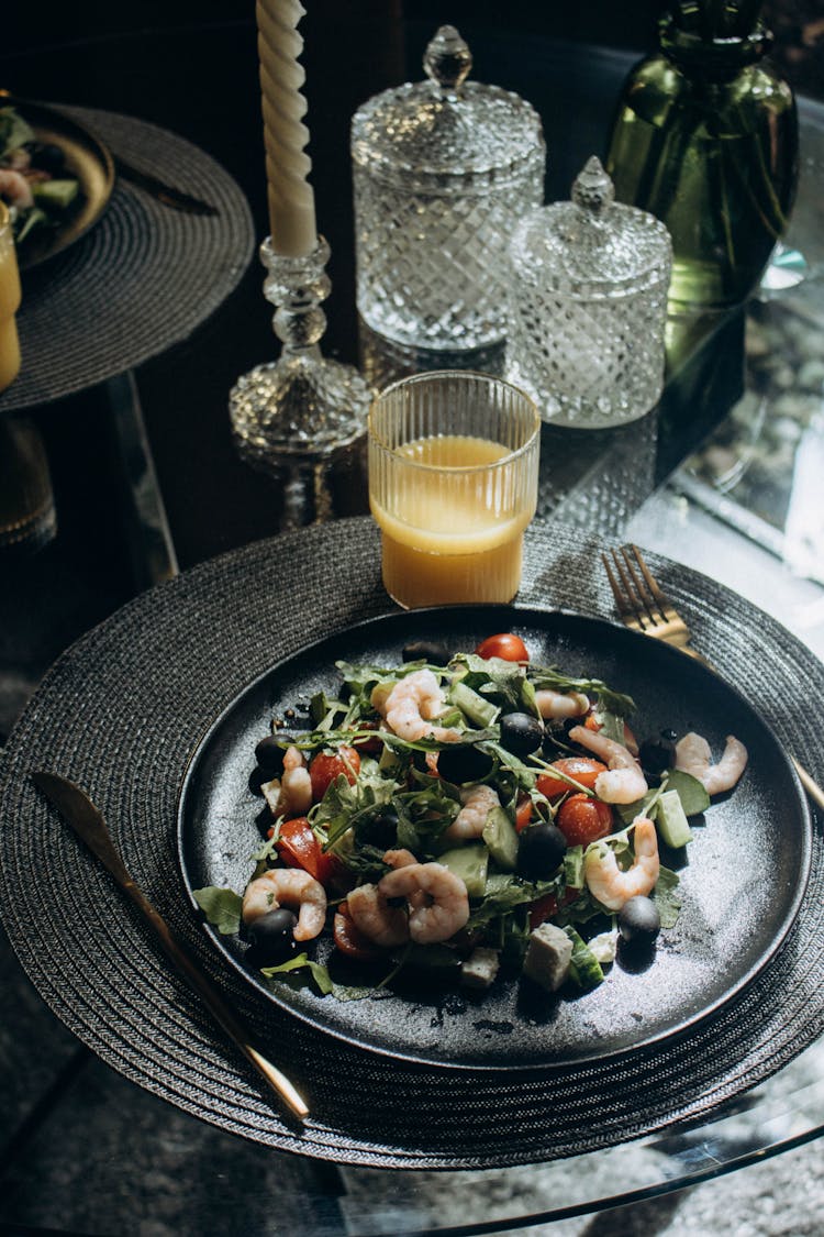 Plate With Meal And Juice Glass Behind