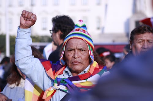 Man in Hat at Gathering