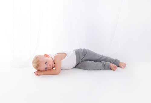 Photo of Baby Lying On Floor