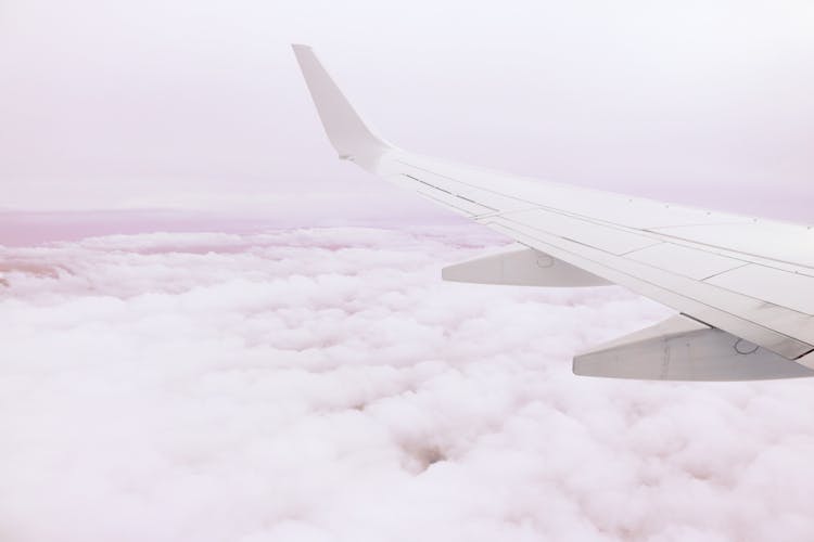 Photo Of Airplane Wing Above The Clouds