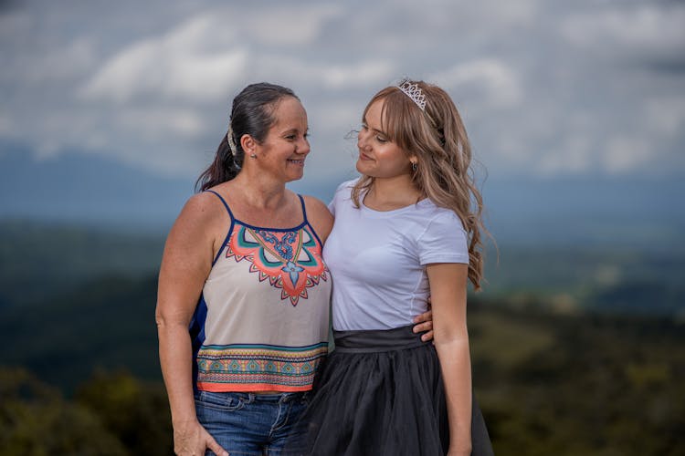 Smiling Mother And Daughter Hugging