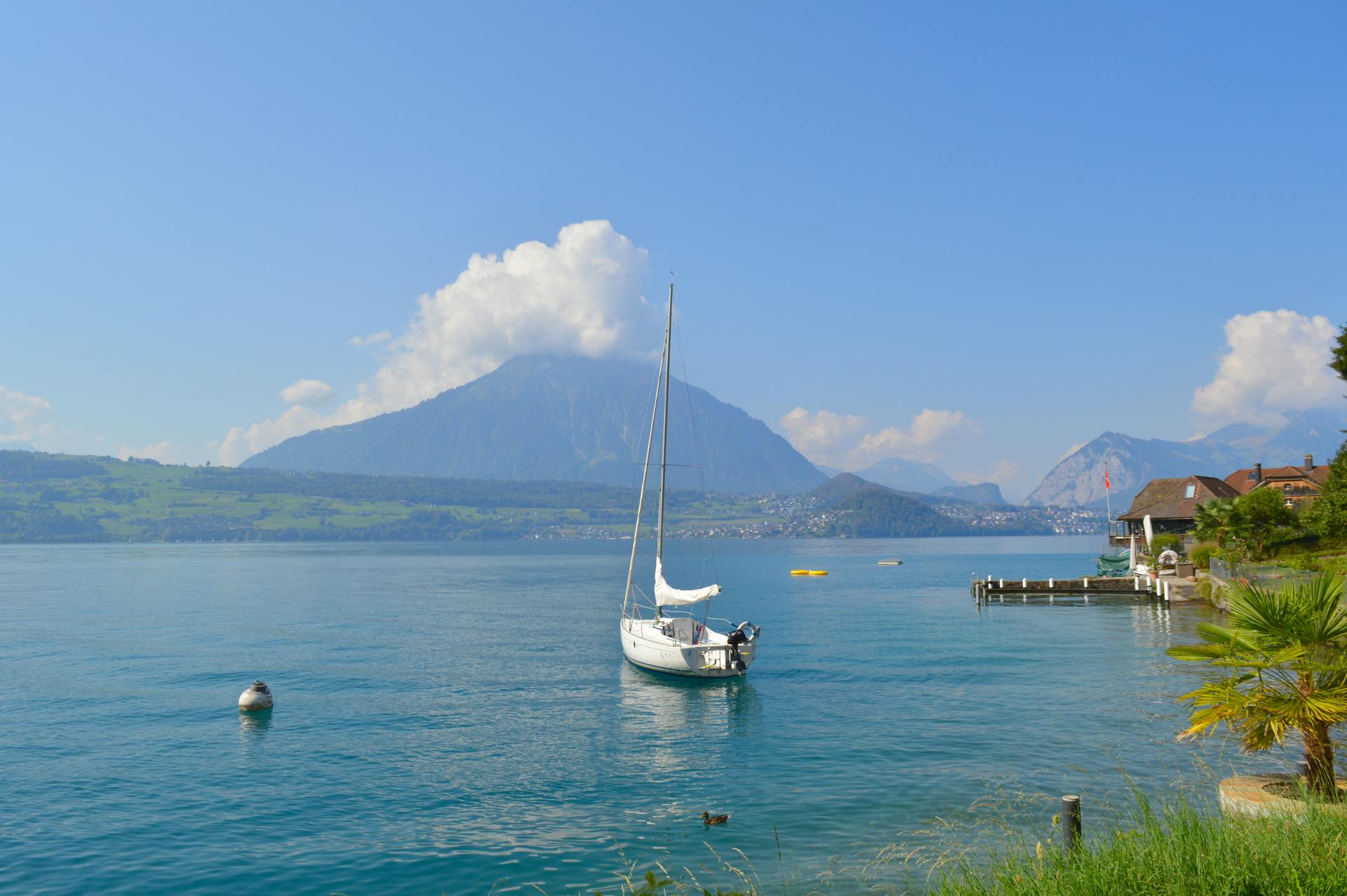 Idyllic Landscape with a Sail Boat Moored in Thun Lake, Switzerland