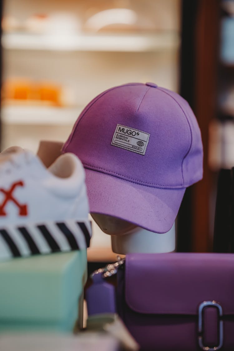 Purple Baseball Cap On Display In A Shop