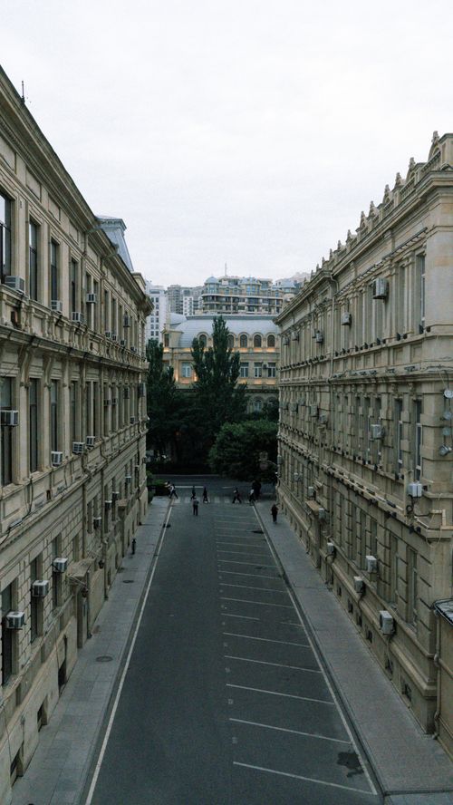 Free Discover the serene neoclassical architecture of a quiet street in Baku, Azerbaijan. Stock Photo