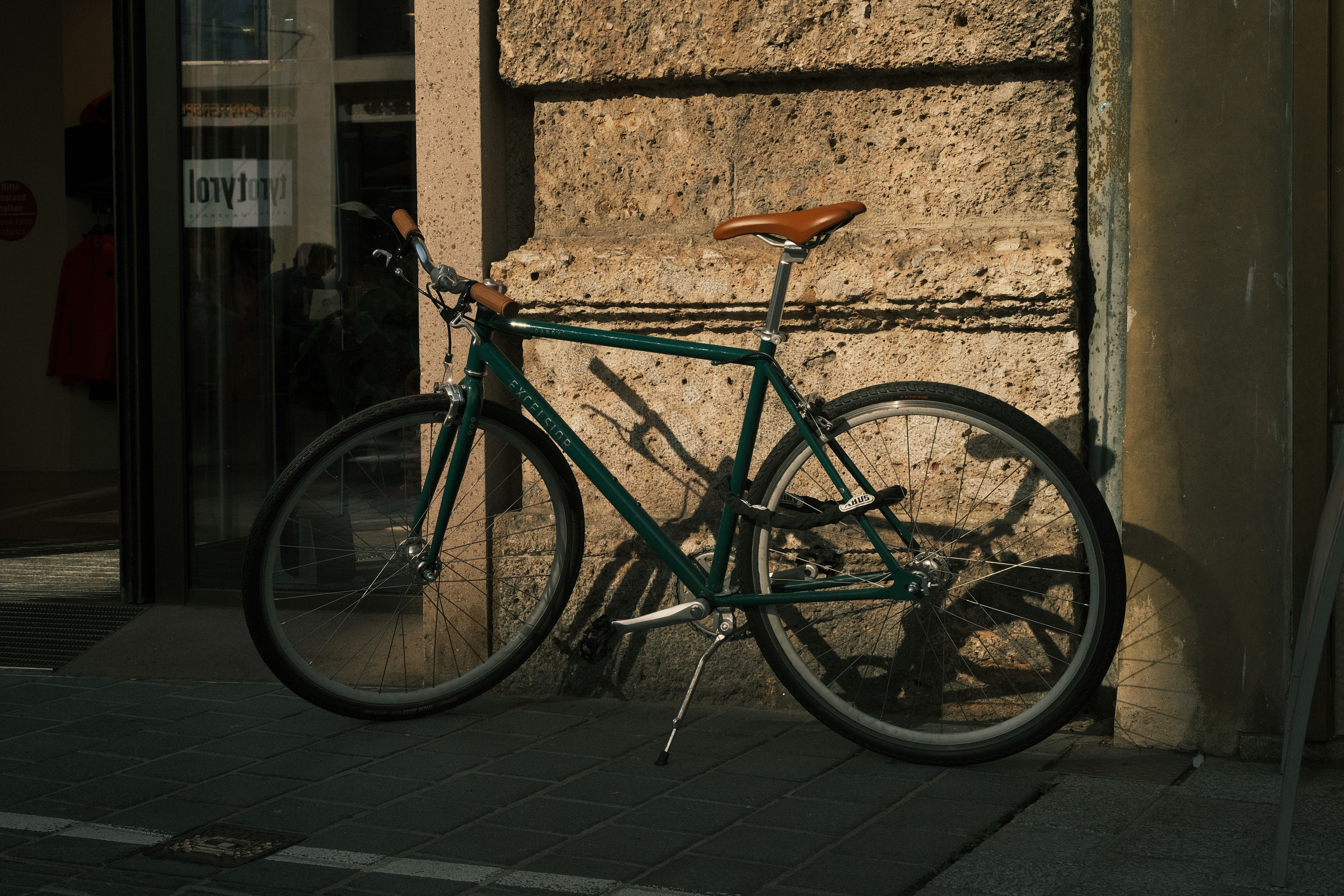 Road bikes stored in a locked ground-floor room at a hotel below the Segovia aqueduct