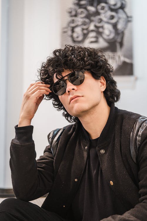 Man in Sunglasses with Curly Hair