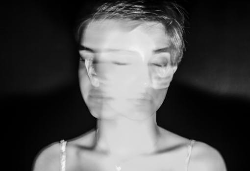 Creative black and white portrait with motion blur, capturing a double exposure effect.